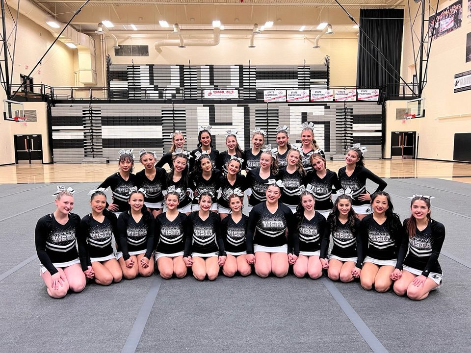 Volcano Vista cheer on the mat in their home gym