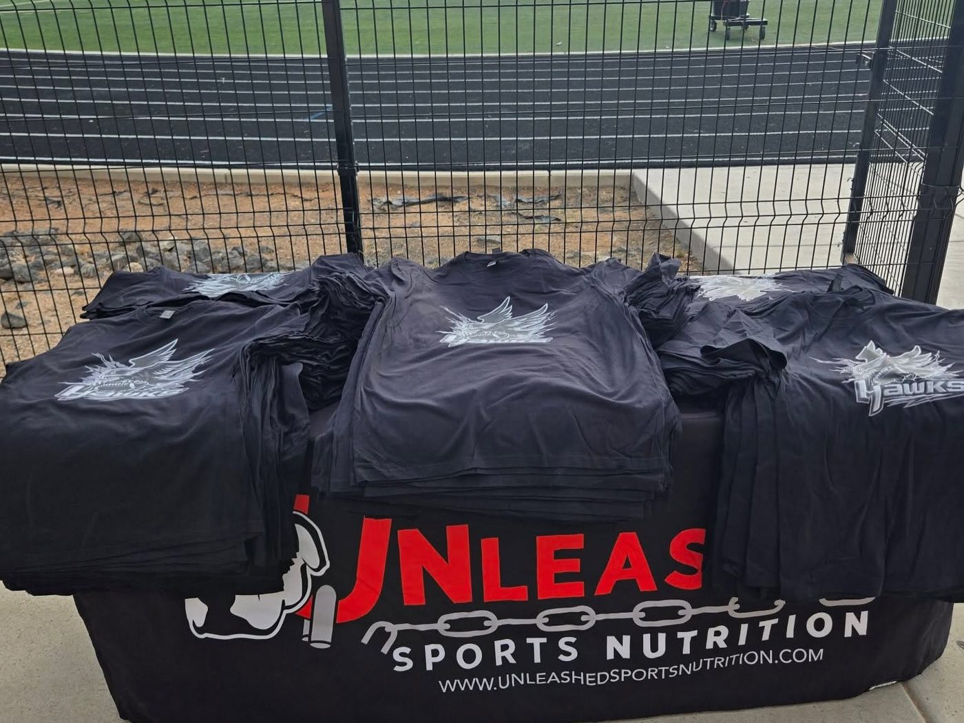 Sponsored team shirts on the Unleashed table