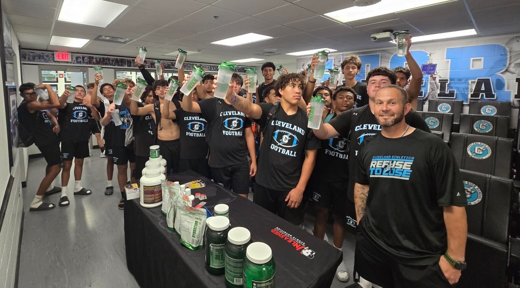 Corey with a team in the field house
